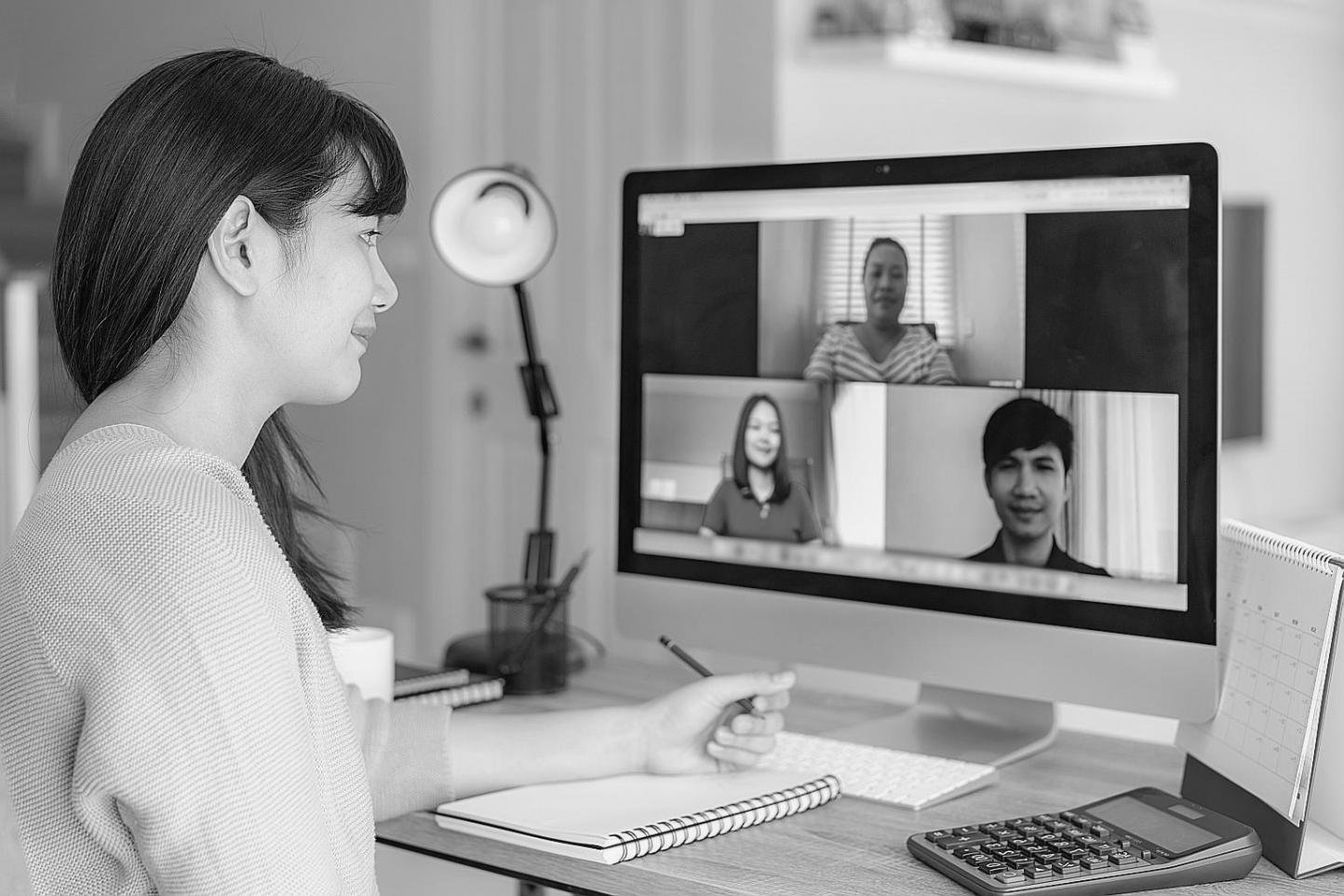 Student reviewing investment research materials with data charts and analysis tools